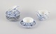 L'Art presents: 
Royal 
Copenhagen Blue 
Fluted Half 
Lace, a set of 
six teacups 
with saucers.