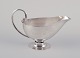 L'Art presents: 
Johan 
Rohde 
(1856-1935) for 
Georg Jensen. 
Sterling silver 
gravy boat.
Hand hammered 
pitcher ...