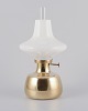 L'Art presents: 
Henning 
Koppel for 
Louis Poulsen.
Petronella oil 
lamp in brass 
with opal glass 
shade.