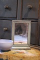 K&Co. presents: 

Swedish 
19th century, 
small mirror 
with small 
shelf 
underneath 
(barber mirror) 
in wood with 
...