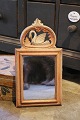 K&Co. presents: 

Swedish 
19th century, 
small mirror in 
wood with a 
fine carved 
swan on top...