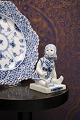 K&Co. presents: 

Royal 
Copenhagen, 
small Blue 
Fluted sitting 
girl. 
1/4793...