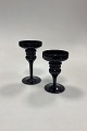 Danam Antik 
presents: 
A pair of 
black glass 
Candlesticks