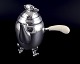 L'Art presents: 
Georg 
Jensen Blossom 
coffee pot in 
hand hammered 
sterling silver 
with bone 
handle.
