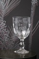 K&Co. presents: 
Old French 
souvenir wine 
glass with 
engraved 
writing and 
decorations. 
"Souvenir de la 
feté"