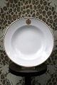 K&Co. presents: 
Royal 
Copenhagen deep 
plate in white 
hotel porcelain 
from Hotel 
D'Angleterre 
with gold 
monogram...
