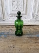 Karstens Antik 
presents: 
Holmegaard 
small green 
bottle 14 cm.