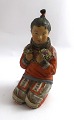 Lundin Antique 
presents: 
Royal 
Copenhagen. 
Figurine of 
Greenlandic 
girl. Model 
12415. Height 
14.5 cm. (1 
quality)