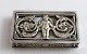 Lundin Antique 
presents: 
Small 
silver box 
(830). With 
mother of pearl 
at the bottom 
of the lid. 
Length 5.3 cm. 
...