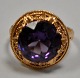 Pegasus – Kunst 
- Antik - 
Design 
presents: 
14 karat 
red gold ring 
with brilliant 
cut amethyst, 
20th century.