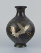 L'Art presents: 
Japan, 
large round 
vase in brass.
Motif of 
cranes in 
silver.