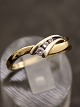 Middelfart 
Antik presents: 
14 carat 
gold ring with 
clear stones