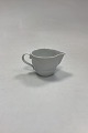 Danam Antik 
presents: 
Royal 
Copenhagen 
White Magnolia 
with Embossed 
Bisque Flowers 
Creamer No. 394