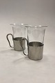Danam Antik 
presents: 
Just 
Andersen/Holmegaard 
A pair of 
Pewter Cups 
with Glass No. 
2504