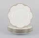L'Art presents: 
A set of 
five ‘Haviland’ 
porcelain 
dinner plates.
Hand-decorated 
gold 
decoration, 
white 
porcelain.