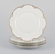 L'Art presents: 
A set of 
four Haviland 
porcelain 
dinner plates.
Hand-decorated 
gold 
decoration, 
white 
porcelain.