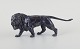 L'Art presents: 
Sculpture 
of roaring male 
lions in black 
patinated 
metal.