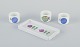L'Art presents: 
Stig 
Lindberg for 
Gustavsberg.
Three ‘Pynta’ 
egg cups and 
small oval tray 
in faience.