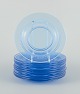 L'Art presents: 
A set of 
ten blue glass 
plates.