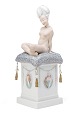 L'Art presents: 
Gerhard 
Henning for 
Royal 
Copenhagen. 
Porcelain 
bobblehead doll 
‘Ane Mari’ 
decorated with 
...