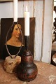 K&Co. presents: 
Antique 
Swedish 
candlestick 
from the year 
1801, with a 
wooden base and 
wrought iron 
candle ...