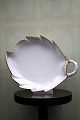 K&Co. presents: 
Rare Royal 
Copenhagen leaf 
shaped cake 
plate in 
Princess with 
gold 
decorations. 
years 
1870-90...
