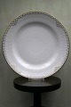 K&Co. presents: 
Rare Royal 
Copenhagen 
dinner plate in 
Princess with 
gold 
decorations. 
from 
1850-70...