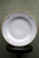 K&Co. presents: 
Rare Royal 
Copenhagen deep 
plate in 
Princess with 
gold 
decorations. 
from 
1893-1900...