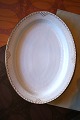 K&Co. presents: 

Rare oval 
Royal 
Copenhagen 
serving dish in 
Princess with 
gold 
decorations. 
41x32.5cm...