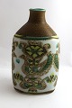 Lundin Antique 
presents: 

Aluminia. 
Baca vase with 
birds. Nils 
Thorsson. Model 
713/3208. 
Height 18 cm. 
(4 quality)