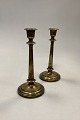 Danam Antik 
presents: 
Antique 
pair of tall 
Candlesticks in 
Brass