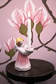 K&Co. presents: 
L. Hjorth 
glazed ceramic 
angel with 
golden hair and 
pink dress 
holding a small 
candle...