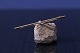 Antik Huset 
presents: 
Gold 
brooch in 14 
karat gold, 
with beautiful 
faceted 
brilliant.