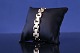 Antik Huset 
presents: 
Blok gold 
bracelet with 3 
rows and 
embossing, in 
14 karat gold.
Length: 18.5 
cm.