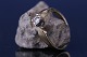 Antik Huset 
presents: 
Ladies' 
ring in 9 carat 
red and white 
gold, with 
diamond. 
Stamped T.A.D, 
375, size 55.