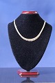 Antik Huset 
presents: 
Necklace 
in 14 carat 
gold, brick in 
5 rows, with a 
gradient, 
stamped 585 
JøS. Length 40 
cm.