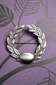 K&Co. presents: 
Fine, old 
Student brooch 
in silver and 
enamel...