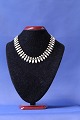 Antik Huset 
presents: 
Volmer 
Bahner necklace 
of gold-plated 
silver & white 
enamel
Length: 38.5 
cm