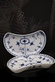 K&Co. presents: 
Royal 
Copenhagen Blue 
Fluted Half 
Lace, 
crescent-shaped 
dish. 
RC# 1/559...