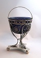 Lundin Antique 
presents: 
Frederik 
Mortz Klose, 
Copenhagen. 
Silver candy 
bowl in 
filigree with 
blue glass ...