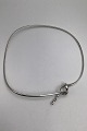 Danam Antik 
presents: 
Georg 
Jensen Sterling 
Silver Neck 
Ring No. 241 
Forget Me Knot 
Torun