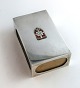 Lundin Antique 
presents: 
Georg 
Jensen. Large 
silver match 
holder with 
king's mark. 
Length 10 cm. 
Produced ...