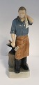Lundin Antique 
presents: 
Royal 
Copenhagen. 
Blacksmith. 
Model 4502. 
Height 23 cm. 
(1 quality)