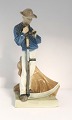 Lundin Antique 
presents: 
Royal 
Copenhagen. 
Harvesting 
Worker with a 
scythe. Model 
no. 685. Height 
25 cm. (1 ...