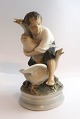 Lundin Antique 
presents: 
Royal 
Copenhagen. 
Porcelain 
figure. The 
Goose Thief. 
Model 2139. 
Height 17 cm. 
(3 quality)