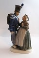 Lundin Antique 
presents: 
Royal 
Copenhagen. 
Porcelain 
figurine. 
Soldier and 
witch. Model 
1112. Height 20 
cm. (4 ...