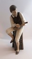 Lundin Antique 
presents: 
Bing & 
Gröndahl. 
Porcelain 
figure. 
Mandolin 
player. Model 
1600. Height 
28.5 cm. (1 ...