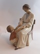 Lundin Antique 
presents: 
Bing & 
Gröndahl. 
Porcelain 
figurine. 
Mother and 
child. Model 
1642. Height 23 
cm. (1 ...