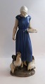 Lundin Antique 
presents: 
Bing & 
Grondahl. 
Porcelain 
figurine. 
Chicken girl. 
Model 2220. 
Height 23.5 cm. 
(1 ...