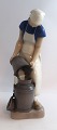 Lundin Antique 
presents: 
Bing & 
Grondahl. 
Porcelain 
figurine. Girl 
with milk 
churn. Model 
2181. Height 
21.5 cm. ...